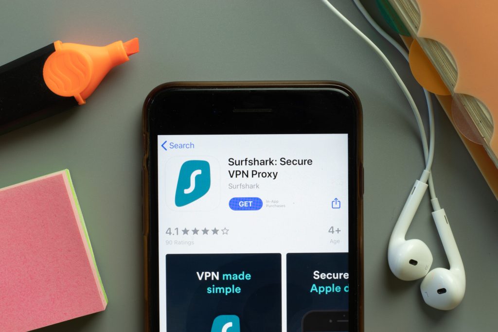New York, USA - 1 December 2020: Surfshark VPN Proxy mobile app icon on phone screen top view, Illustrative Editorial