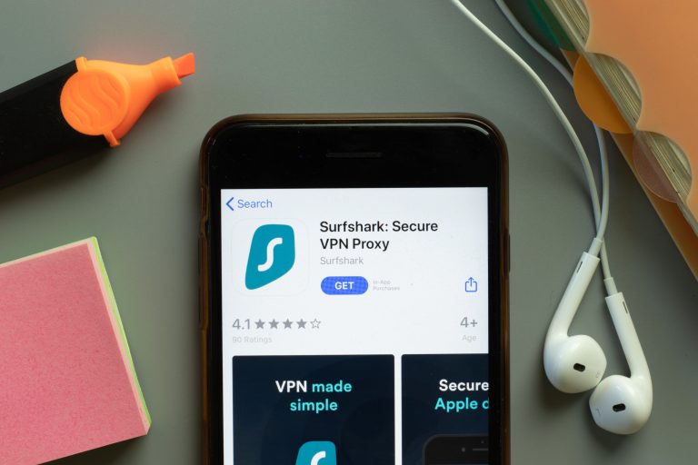 New York, USA - 1 December 2020: Surfshark VPN Proxy mobile app icon on phone screen top view, Illustrative Editorial